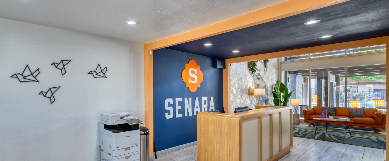 the lobby of a hotel with a sign that says sena at The Senara