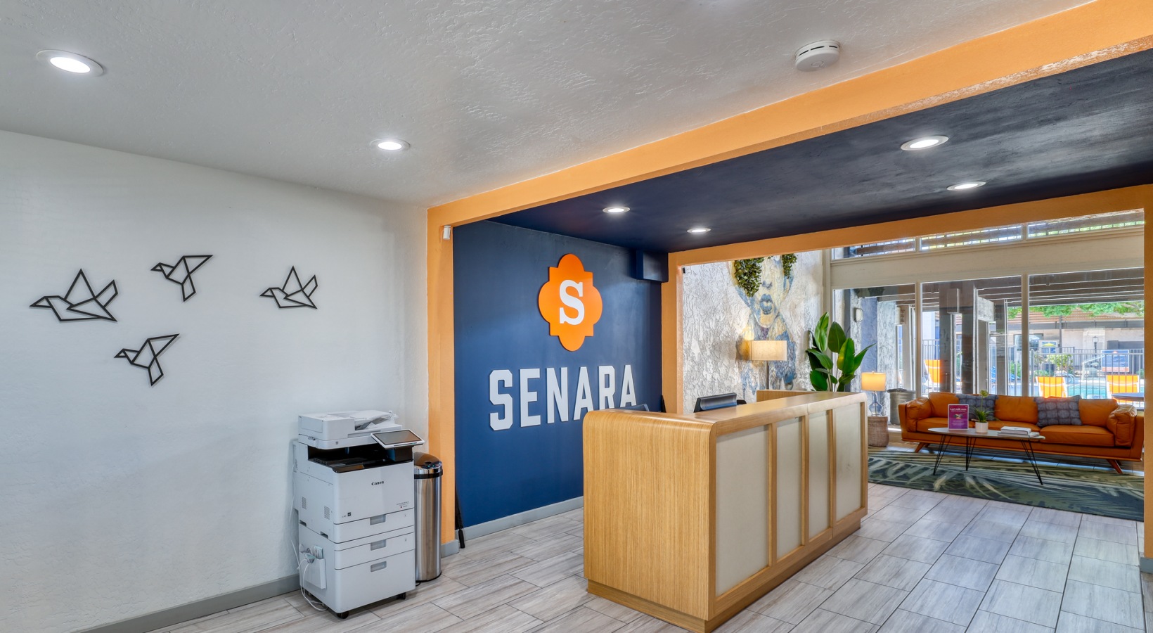 the lobby of a hotel with a sign that says sena at The Senara