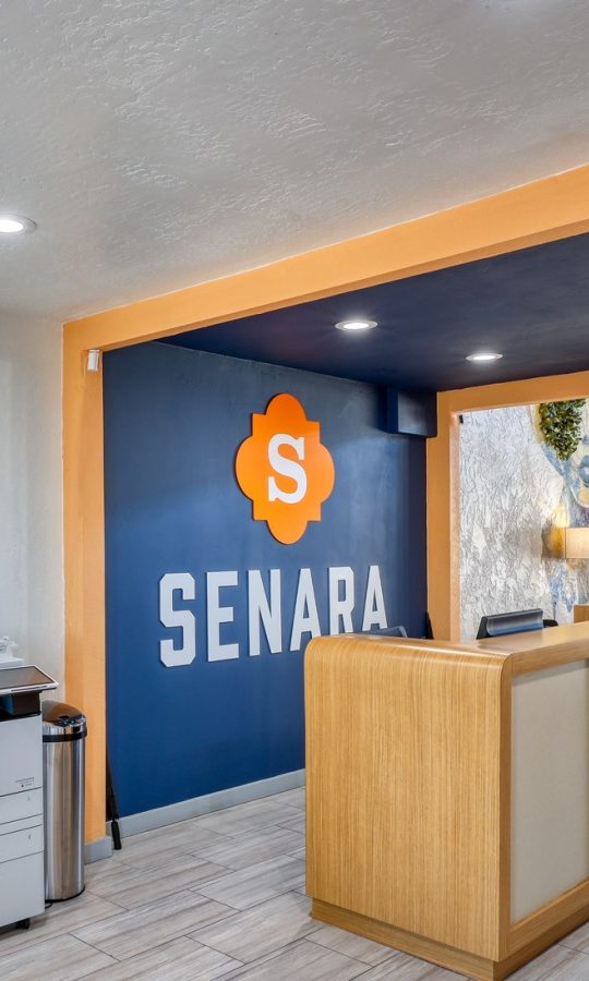 the lobby of a hotel with a sign that says sena at The Senara