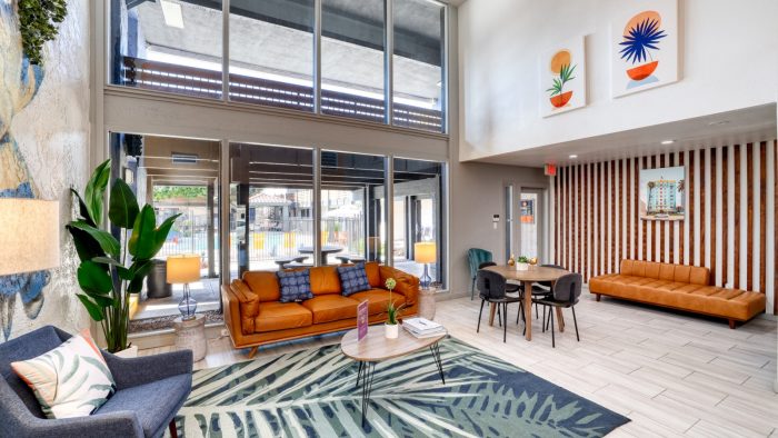 the living room has a large couch and chairs at The Senara